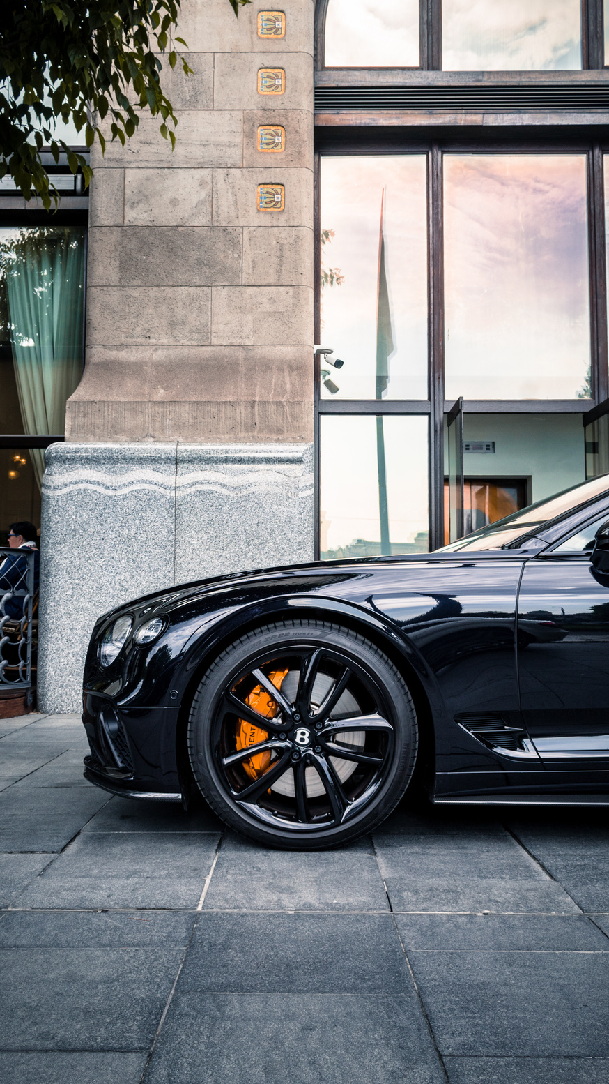 Black Front Wheel of a Black Car